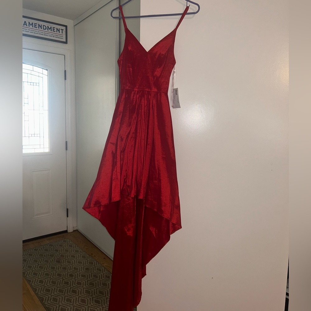 Red high low Betsy Adam’s dress size 4. Never worn